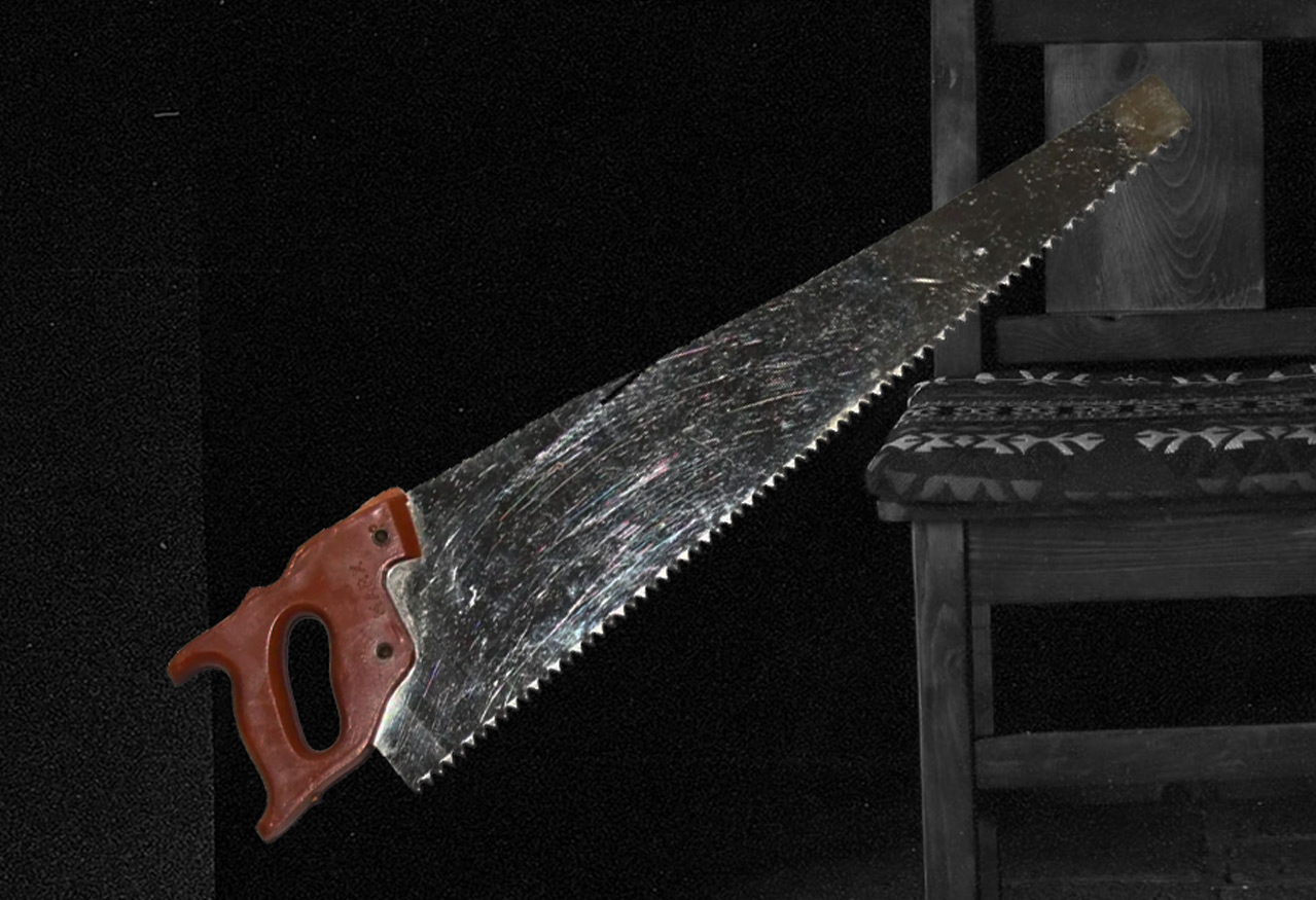 A simple wooden chair  sitting in a dark room with a handsaw over it on a black background