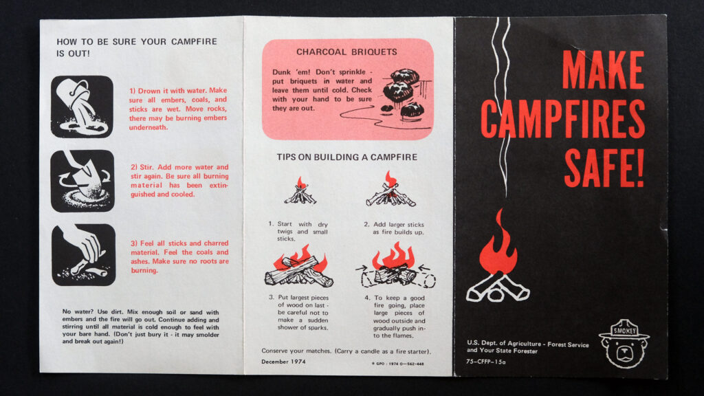 A black, white, and orange vintage Forest Service pamphlet says "Make campfires safe!" in orange above a campfire illustration